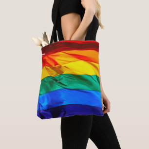 SlipperyJoe's gay pride flag waving red orange yel Tote Bag