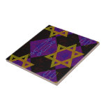SlipperyJoe's Hanukkah-themed image golden yellow  Ceramic Tile<br><div class="desc">SlipperyJoe's Hanukkah-themed image golden yellow Star of David blue candles with orange flames Menorah-inspired art gift idea Jewish identity spirituality holiday retro bold symmetrical pattern diamond-shaped grid background blends tradition and vibrant design purple black chequerboard effect Hebrew religious celebration</div>