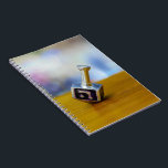 SlipperyJoe's Happy Hanukkah four-sided spinning t Notebook<br><div class="desc">SlipperyJoe's Happy Hanukkah four-sided spinning top dreidel artistic Celebration Candles Jewish Hebrew Chanukah gifts decorations Judaism religion Hebrew letter Nun traditional toy children adult game cultural symbol metallic shiny finish wooden surface</div>