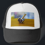SlipperyJoe's Happy Hanukkah four-sided spinning t Trucker Hat<br><div class="desc">SlipperyJoe's Happy Hanukkah four-sided spinning top dreidel artistic Celebration Candles Jewish Hebrew Chanukah gifts decorations Judaism religion Hebrew letter Nun traditional toy children adult game cultural symbol metallic shiny finish wooden surface</div>