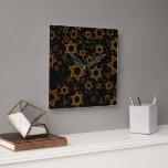 SlipperyJoe's Happy Hanukkah multiple Stars of Dav Square Wall Clock<br><div class="desc">SlipperyJoe's Happy Hanukkah multiple Stars of David pattern artistic Celebration Jewish identity heritage Hebrew Chanukah gifts decorations Judaism significant symbol religion various sizes brown gold shades visually appealing intricate design</div>
