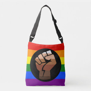 SlipperyJoe's queer people colour flag raised fist Crossbody Bag