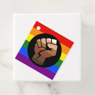 SlipperyJoe's queer people colour flag raised fist Favour Tags