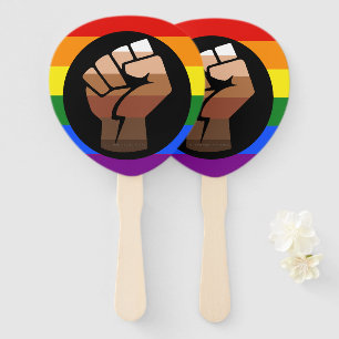 SlipperyJoe's queer people colour flag raised fist Hand Fan