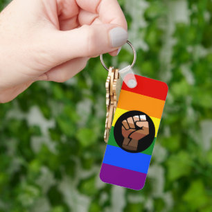 SlipperyJoe's queer people colour flag raised fist Key Ring
