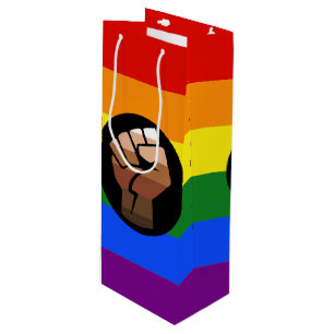 SlipperyJoe's queer people colour flag raised fist Wine Gift Bag