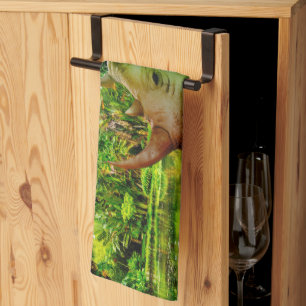 SlipperyJoe's rhinoceros lush tropical setting pri Tea Towel