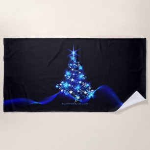 SlipperyJoe's stylised glowing Christmas tree brig Beach Towel