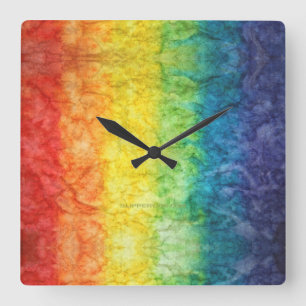 SlipperyJoe's tie-dyed flag rainbow pressed into s Square Wall Clock