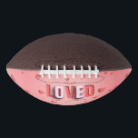 SlipperyJoe's Valentine's Day gifts romantic tone  Football<br><div class="desc">SlipperyJoe's Valentine's Day gifts romantic tone scattered heart shapes expressing love appreciation uplifting inclusive and affectionate tone vibrant celebratory graphic warmth affection soft pink canvas background you are loved text LGBTQIA white letters red outlines shadow artistic three-dimensional standout effect playful 3D-elements bold typography</div>