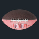 SlipperyJoe's Valentine's Day gifts romantic tone Football<br><div class="desc">SlipperyJoe's Valentine's Day gifts romantic tone scattered heart shapes expressing love appreciation uplifting inclusive and affectionate tone vibrant celebratory graphic warmth affection soft pink canvas background you are loved text LGBTQIA white letters red outlines shadow artistic three-dimensional standout effect playful 3D-elements bold typography</div>