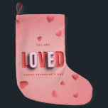 SlipperyJoe's Valentine's Day gifts romantic tone Small Christmas Stocking<br><div class="desc">SlipperyJoe's Valentine's Day gifts romantic tone scattered heart shapes expressing love appreciation uplifting inclusive and affectionate tone vibrant celebratory graphic warmth affection soft pink canvas background you are loved text LGBTQIA white letters red outlines shadow artistic three-dimensional standout effect playful 3D-elements bold typography</div>