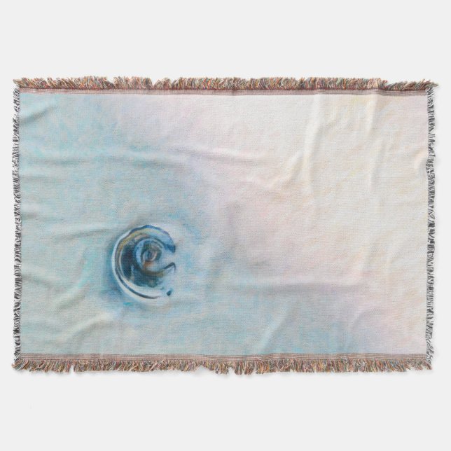 Slow motion wave towards a blue seashell throw blanket (Front)