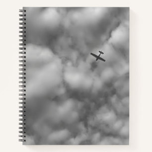 Small Airplane Flying in Cloudy Sky Photo Notebook