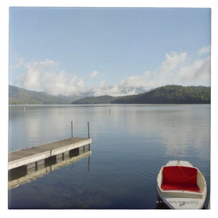 Small boat tied up on dock at Lake Placid Ceramic Tile