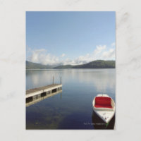 Small boat tied up on dock at Lake Placid