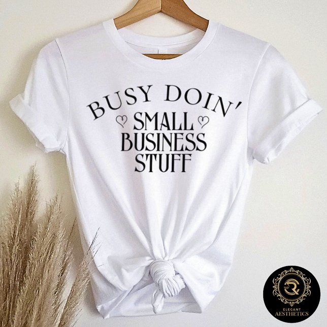 Small Business Owner Quote Business Casual T-Shirt (White t-shirt on hanger with quote "Busy Doin' Small Business Stuff")