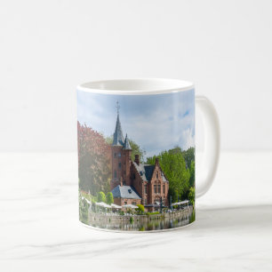 Small castle near lake in Bruges, Belgium Coffee Mug