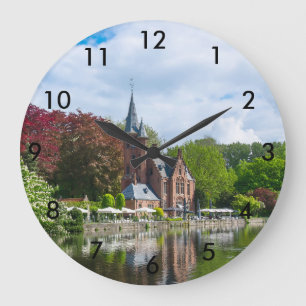 Small castle near lake in Bruges, Belgium Large Clock
