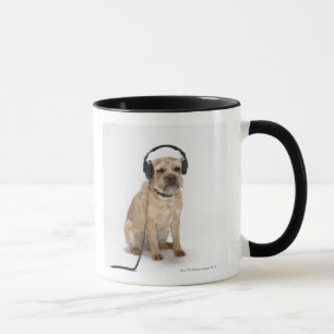 Small dog wearing headphones mug