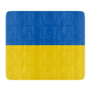Small glass cutting board with Ukraine flag