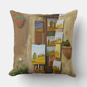 Small shope with artwork for sale on sidewalk cushion