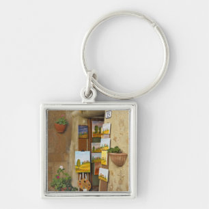 Small shope with artwork for sale on sidewalk key ring