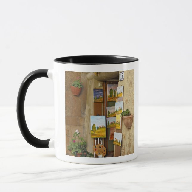 Small shope with artwork for sale on sidewalk mug (Left)