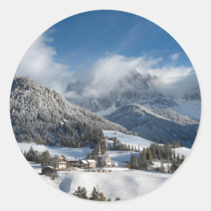 Small village with Dolomites mountains in the snow Classic Round Sticker