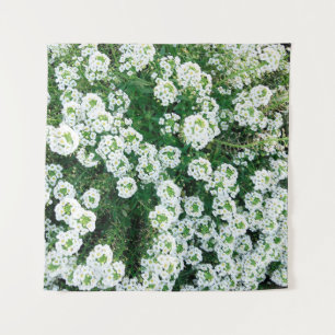 Small white flowers in the grass in the daytime in tapestry