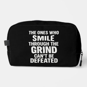 Smile grind gym motivation quote with white text dopp kit