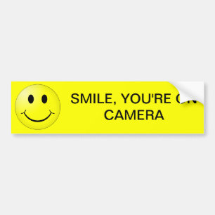 SMILE, YOU'RE ON CAMERA BUMPER STICKER