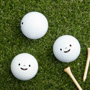 Smiling face in black and white golf balls