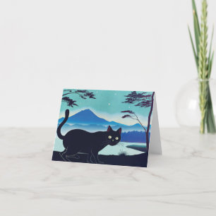 Sneaky black cat by a lake greetings card