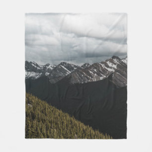 SNOW-CAPPED GRAY ROCKY MOUNTAIN UNDER CLOUDY SKY D FLEECE BLANKET