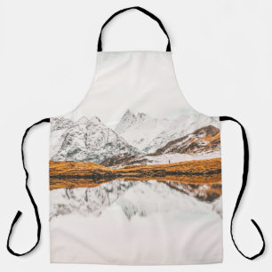 SNOW-CAPPED ROCKY MOUNTAIN UNDER CLOUDY SKY DURING APRON