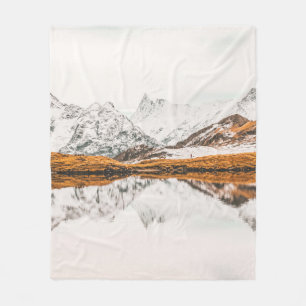 SNOW-CAPPED ROCKY MOUNTAIN UNDER CLOUDY SKY DURING FLEECE BLANKET