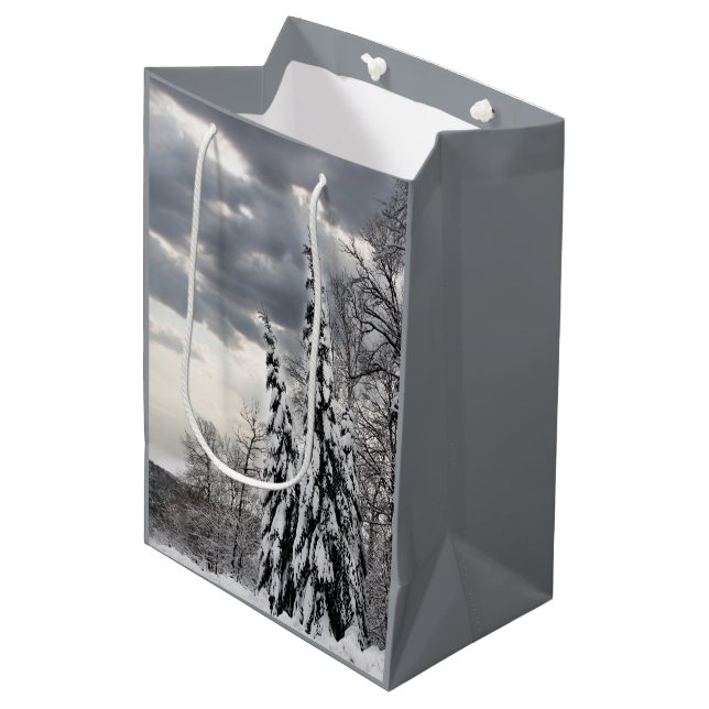 Snow-Covered Evergreen Trees Under Dramatic Winter Medium Gift Bag (Front Angled)