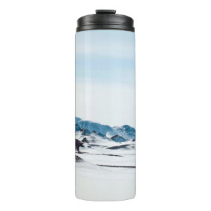 SNOW-COVERED LAND DURING DAY TIME THERMAL TUMBLER
