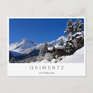 Snow-covered log cabins in Switzerland Postcard