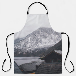 SNOW-COVERED MOUNTAIN NEAR BODY OF WATER APRON