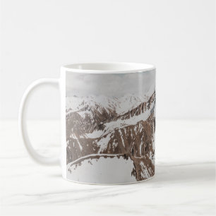 SNOW COVERED MOUNTAIN UNDER WHITE CLOUDS DURING DA COFFEE MUG