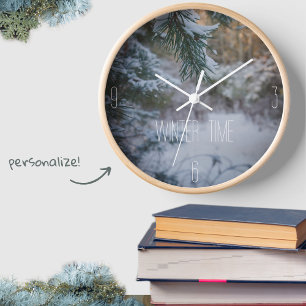 Snow-covered pine branches clock