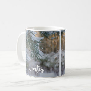 Snow-covered pine branches coffee mug