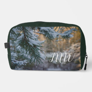 Snow-covered pine branches dopp kit