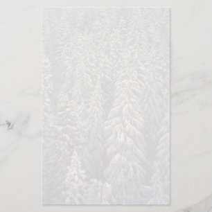 Snow-covered pine trees stationery