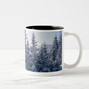 Snow-covered trees and mountains Two-Tone coffee mug