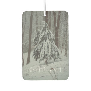 Snow-covered trees in the misty winter forest car air freshener