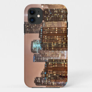 Snow falls over skyline at evening in Chicago iPhone 11 Case