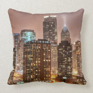 Snow falls over skyline at evening in Chicago Cushion